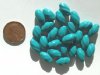25 13mm Twisted Opaque Turquoise Ovals